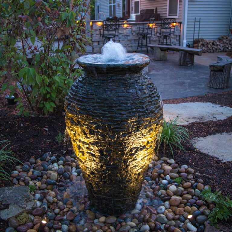 Fountainscape-Stacked-Slate-Urn-next-to-patio-with-lights_02