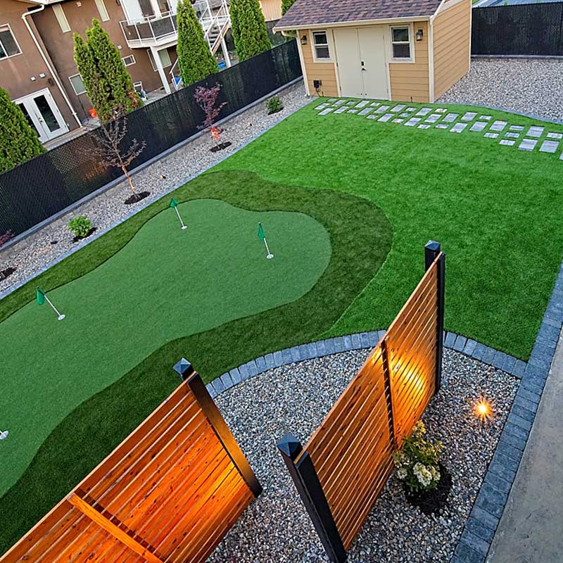 Kalagan Outdoor Design astroturf putting green accent lighting on fences
