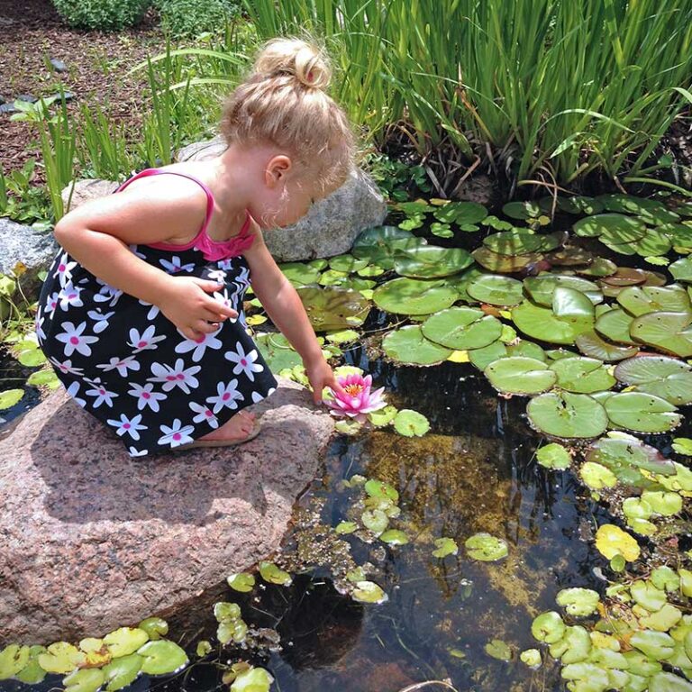 Little-girl-next-to-pond_09